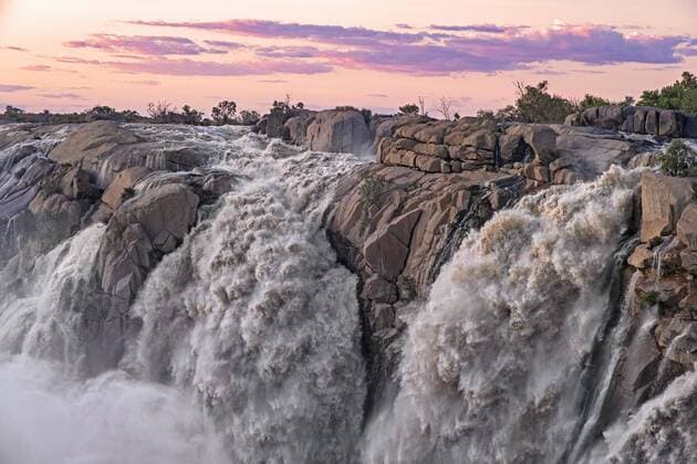 Creative Highlights World Wasserfall am Orange River im Augrabies Falls National Park bei Sonnenuntergang, Nordkap-Provinz, Südafrika *** Waterfall on Orange River at Augrabies Falls National Park at Sunset, North Cape Province, South Africa Copyright: imageBROKER/alimdix/xArterra ibltsm08843107.jpg