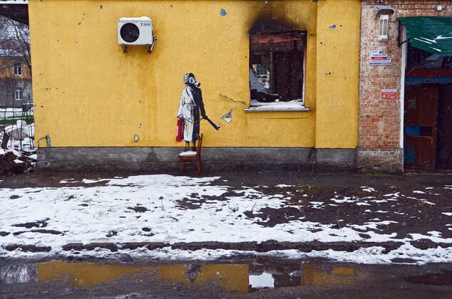 HOSTOMEL, UKRAINE - NOVEMBER 26, 2022 - The mural by England-based street artist Banksy depicts a woman in a gas mask standing on a chair and holding a fire extinguisher, Hostomel, Kyiv Region, northern Ukraine. Banksy?s murals in Kyiv Region  Copyright: xOleksandraxButovax
