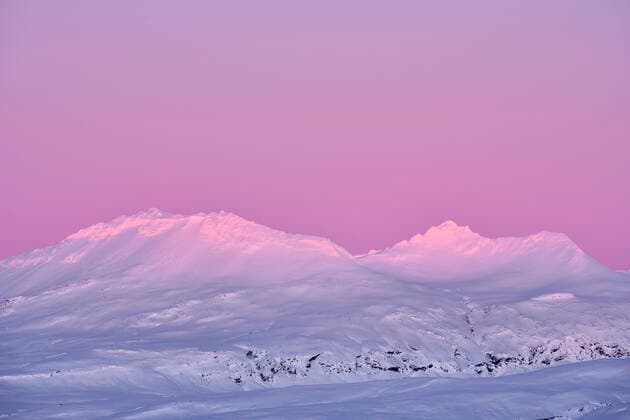 Creative Highlights World Snowy mountain ridge in twilight Selfoss, Iceland CR_OSBJ221128-1076659-01
