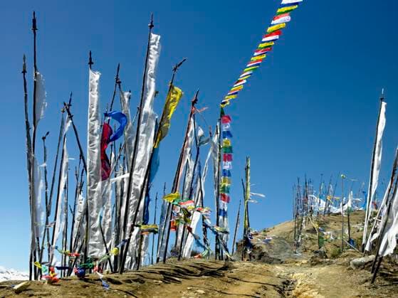 RECORD DATE NOT STATED Buddhist prayer flags on a hillside high in the Himalayas in the Kingdom of Bhutan. , 9590392.jpg, kingdom, Bhutan, Bhutaese, travel, tourism, Himalayas, Asia, prayer flags, religion, religious, Buddhism, Buddhist, hillside, sacred, Kingdom of Bhutan,