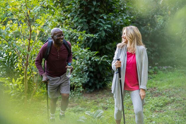 RECORD DATE NOT STATED Senior couple using walking stick during trekking tour Copyright: GabrielxSanchez B90924042