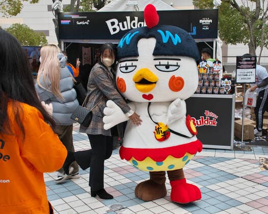 Japanese fan is seen take photos at booth event of the 2022 MAMA(Mnet Asian Music Awards) in Osaka, Japan on Wednesday, November 30, 2022.  TKP2022113002 KEIZOxMORI