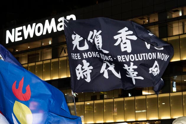 November 30, 2022, Tokyo, Japan: A flag calling for Democracy in Hong Kong. ..Tokyoites, Hong Kongers, Taiwanese, Uyghurs and Chinese dissidents protest outside Shinjuku Station against President Xi Jingping and the governing Chinese Communist Party s (CCP) draconian Zero-COVID policy after a fire in an ooeroÂ¼mqi, capitol of the Xinjiang Uyghur Autonomous Region, high rise building killed 10 people. The incident sparked the largest wave of civil unrest across China since the 1989 Tiananmen Square Pro-Democracy movement as protesters claim residents were locked into their homes by authorities enforcing strict COVID mandates. Chinese authorities deny these allegations and claim that parked cars delayed firefighters from accessing the build - ZUMAb177 20221130_zap_b177_037 Copyright: xTaidghxBarronx