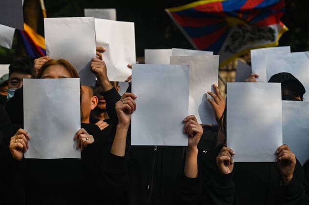 December 2, 2022, New Delhi, Delhi, India: Activists of the Tibetan Youth Congress (TYC) hold blank papers against the China s Zero COVID Policy and in solidarity with the ongoing Whitepaper Protests in China, in New Delhi. New Delhi India - ZUMAj168 20221202_zip_j168_002 Copyright: xKabirxJhangianix