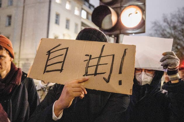 December 5, 2022, London, United Kingdom: A protester was seen holding a placard written freedom in Chinese during the demonstration outside the Chinese Embassy in London. Chinese students who are currently studying in London gathered at the Chinese Embassy in London to protest against the lockdown policy in China. A massive wave of protests outbroke in China last week since 10 people were killed in a Urumqi in the Northwest region of China due to the inhumane COVID lockdown policy. London United Kingdom - ZUMAs197 20221205_zaa_s197_040 Copyright: xHestherxNgx