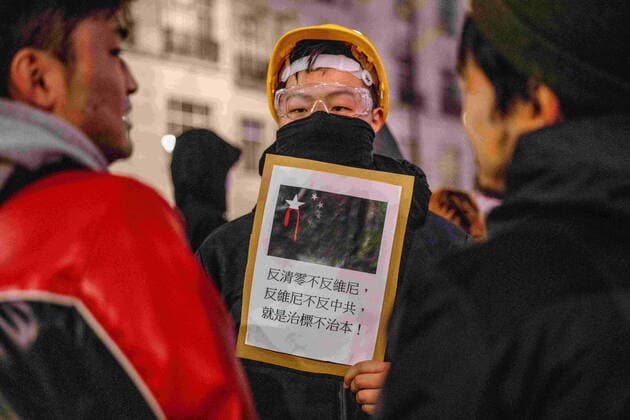December 5, 2022, London, United Kingdom: A protester was seen holding a placard with demands to their government written in Chinese during the demonstration outside the Chinese Embassy in London. Chinese students who are currently studying in London gathered at the Chinese Embassy in London to protest against the lockdown policy in China. A massive wave of protests outbroke in China last week since 10 people were killed in a Urumqi in the Northwest region of China due to the inhumane COVID lockdown policy. London United Kingdom - ZUMAs197 20221205_zaa_s197_049 Copyright: xHestherxNgx