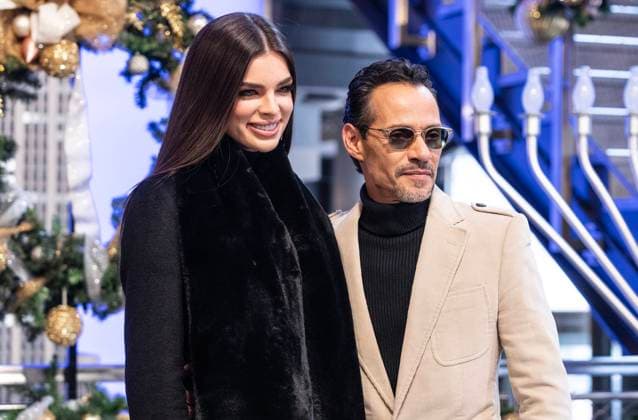 NY: Marc Anthony visits Empire State Building Nadia Ferreira and Marc Anthony pose on grand staircase during visit to Empire State Building. Marc Anthony helps to ceremonial lighting of ESB in gold on Maestro Cares golden anniversary. New York New York United States Copyright: LevxRadin