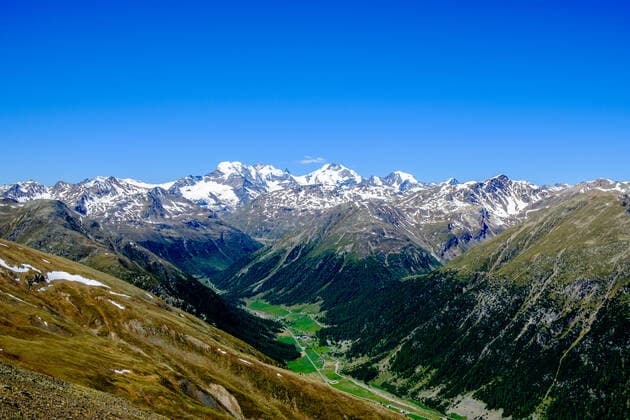 Aerial view on the valley of Livigno town with the Bernina Mountains in the distance Livigno Lombardy Italy Reise FB_2017_3789