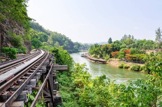 RECORD DATE NOT STATED Beautiful landscape Death Railway bridge over the Kwai Noi River at Krasae cave in Kanchanaburi province Thailand , 22437650.jpg, Death Railway, railway, bridge, river, Kanchanaburi, Thailand, Burma Railway, Krasae, wood, Kwai Noi, landscape, beautiful, landmark, resort, floating, home, old, mountain, nature, outdoor, high, view, destination, asia, built, cave, construction, cross, green, historic, history, house, journey, park, rail, railroad, residence, scenery, scenic, Siam, sky, structure, thai, tourism, track, traffic, travel, tree, water, way,