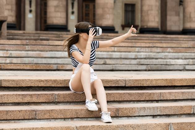 RECORD DATE NOT STATED Young girl sitting on the stairs, near the university, in virtual reality in VR, model released, , 22781024.jpg, on the steps, sitting, building, university, business, female, girl, happy, leisure, lifestyle, mobility, modern, outdoor, portable, student, study, technology, thinking, wireless, woman, young, adult, education, teenager, reality, virtual, device, glasses, vision, entertainment, 3d, visual, science, innovation, play, tech, watching, hi-tech, gaming, industry, looking, future, simulation, simulator, recreational, futuristic, system, 360, virtual world, vr,