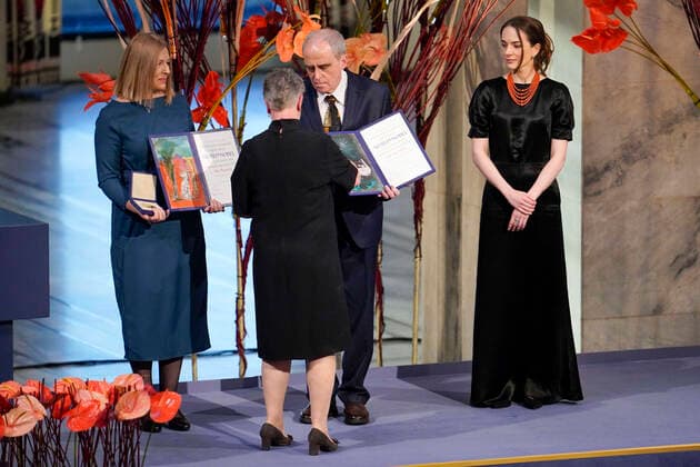 Oslo 20221210 Chair Berit Reiss Andersen of the Nobel Committee awards fv Natallia Pintsyuk, who represents her husband, activist Ales Byalyatski from Belarus Jan Ratchinskij, who represents the Russian organization Memoria  Copyright: xRodrigoxFreitasx _DviwmGb3hM