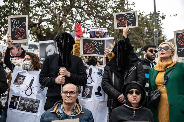 December 10, 2022, Istanbul, Turkey: Protesters performed an execution scene with ropes around their necks during the demonstration. Mahsa Amini s death has sparked weeks of violent protests across Iran and other countries. Mahsa fell into a coma and died after being arrested in Tehran by the morality police for allegedly violating the country s hijab rules. In the trials regarding the protests, 11 people have been sentenced to death so far. Istanbul Turkey - ZUMAs197 20221210_zaa_s197_157 Copyright: xOnurxDogmanx