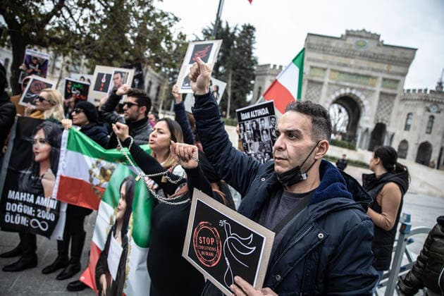 December 10, 2022, Istanbul, Turkey: Protesters hold placards expressing their opinion during the demonstration. Mahsa Amini s death has sparked weeks of violent protests across Iran and other countries. Mahsa fell into a coma and died after being arrested in Tehran by the morality police for allegedly violating the country s hijab rules. In the trials regarding the protests, 11 people have been sentenced to death so far. Istanbul Turkey - ZUMAs197 20221210_zaa_s197_165 Copyright: xOnurxDogmanx