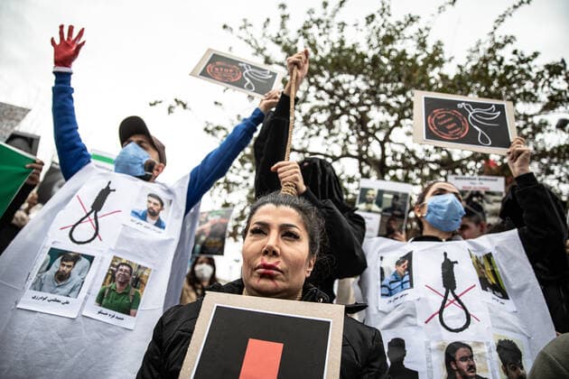 December 10, 2022, Istanbul, Turkey: Protesters hold placards expressing their opinion during the demonstration. Mahsa Amini s death has sparked weeks of violent protests across Iran and other countries. Mahsa fell into a coma and died after being arrested in Tehran by the morality police for allegedly violating the country s hijab rules. In the trials regarding the protests, 11 people have been sentenced to death so far. Istanbul Turkey - ZUMAs197 20221210_zaa_s197_166 Copyright: xOnurxDogmanx