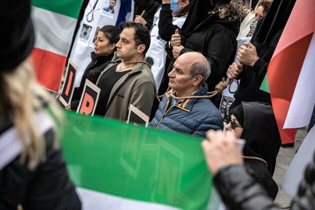 December 10, 2022, Istanbul, Turkey: Protesters performed an execution scene with ropes around their necks, during the demonstration. Mahsa Amini s death has sparked weeks of violent protests across Iran and other countries. Mahsa fell into a coma and died after being arrested in Tehran by the morality police for allegedly violating the country s hijab rules. In the trials regarding the protests, 11 people have been sentenced to death so far. Istanbul Turkey - ZUMAs197 20221210_zaa_s197_172 Copyright: xOnurxDogmanx
