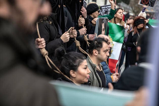 December 10, 2022, Istanbul, Turkey: Protesters performed an execution scene with ropes around their necks, during the demonstration. Mahsa Amini s death has sparked weeks of violent protests across Iran and other countries. Mahsa fell into a coma and died after being arrested in Tehran by the morality police for allegedly violating the country s hijab rules. In the trials regarding the protests, 11 people have been sentenced to death so far. Istanbul Turkey - ZUMAs197 20221210_zaa_s197_173 Copyright: xOnurxDogmanx