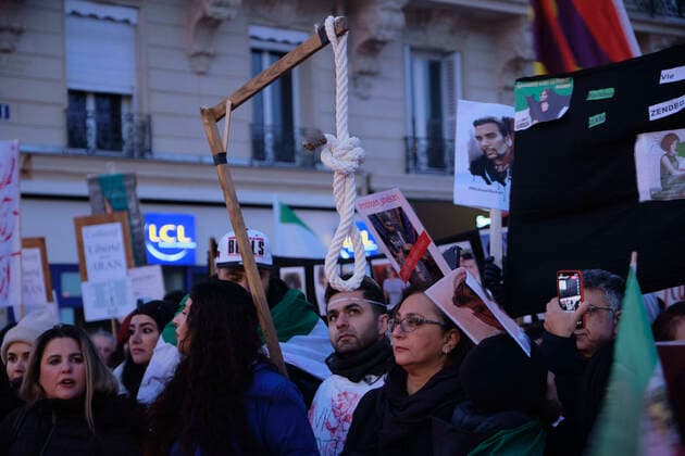 December 11, 2022, Paris, Ile de France, FRANCE: Hundreds of people marched in Paris to denounce the Islamic regime in Iran. Mohsen Shekari was the first Iranian to be excecuted on Thursday, december 8th 2022 by the increasingly repressive Iranian regime for participating in protests with more facing the death penalty on similar charges. Paris FRANCE - ZUMAh172 20221211_zip_h172_001 Copyright: xRemonxHaazenx