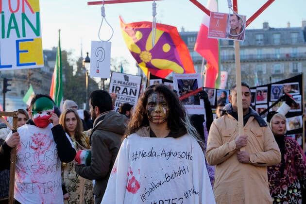 December 11, 2022, Paris, Ile de France, FRANCE: Hundreds of people marched in Paris to denounce the Islamic regime in Iran. Mohsen Shekari was the first Iranian to be excecuted on Thursday, december 8th 2022 by the increasingly repressive Iranian regime for participating in protests with more facing the death penalty on similar charges. Paris FRANCE - ZUMAh172 20221211_zip_h172_002 Copyright: xRemonxHaazenx
