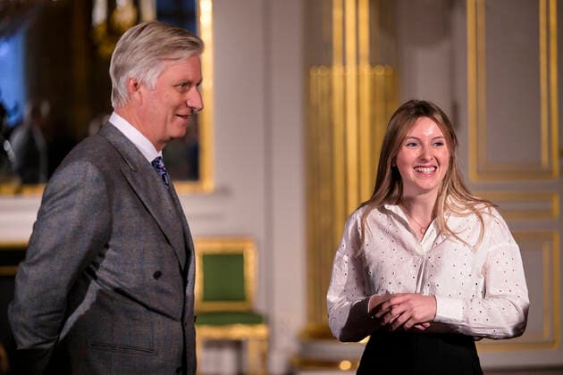 King Philippe - Filip of Belgium and Winner Lea Defour pictured during the award ceremony of the 2022 edition of the Belgodyssee prize for young journalists, at the Royal Palace in Brussels, Tuesday 13 December 2022. The contest is an initiative of the Prince Philippe Fund, the VRT and the RTBF, in collaboration with Metro and L Avenir, and with the support of the Chancellery of the Prime Minister and Brussels Airlines.  LAURIExDIEFFEMBACQ 55997345
