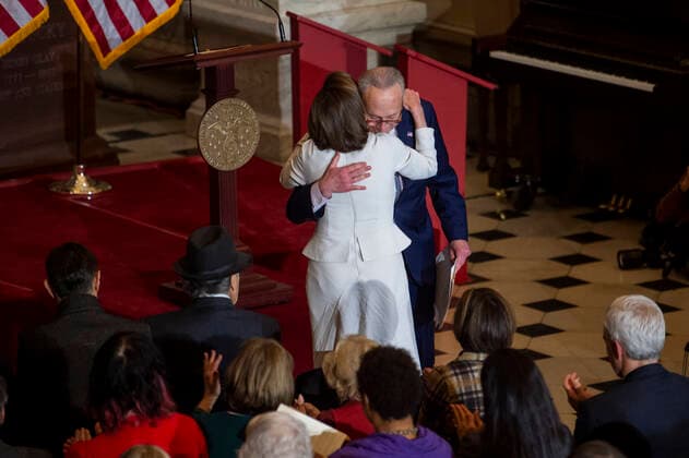 December 14, 2022, Washington, District of Columbia, USA: United States Senate Majority Leader Chuck Schumer (Democrat of New York) embraces Speaker of the United States House of Representatives Nancy Pelosi (Democrat of California) during a portrait unveiling ceremony honoring her in Statuary Hall at the US Capitol in Washington, DC, Wednesday, December 14, 2022 Washington USA - ZUMAs152 20221214_zaa_s152_108 Copyright: xRodxLamkeyx