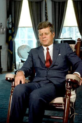**FILE PHOTO** National Archives release classified JFK assassination files. Washington, D.C. - Undated File Photo c. 1963 -- United States President John F. Kennedy sits in his rocking chair in the Oval Office of the White House in Washington, D.C. . Copyright: xCNP xMediaPunchx