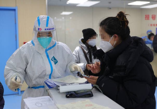 (221217) -- SHENYANG, Dec. 17, 2022 -- A medical worker works at a fever clinic at Shengjing Hospital of China Medical University in Shenyang, northeast China s Liaoning Province, Dec. 15, 2022. China is continuing its optimization of COVID-19 epidemic prevention and control measures as it shifts the focus of its response strategy from curbing new infections to preventing and treating severe cases. The fever clinic of the hospital is trying its best to ensure the treatment of patients with acute and severe symptoms. ) CHINA-LIAONING-SHENYANG-FEVER CLINIC (CN) YangxQing 