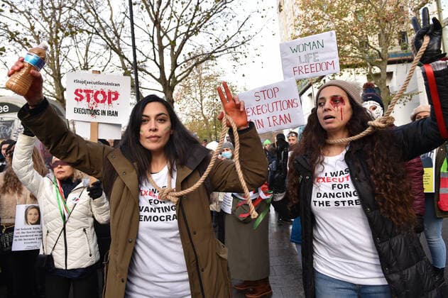 December 17, 2022, London, England, United Kingdom: Protesters take part in a demonstration in central London, calling to stop executions of protesters in Iran, and in solidarity with the freedom uprising in Iran, over the death of Mahsa Amini in custody, by Iranian morality police. Mahsa Amini was killed on 16 September, after her arrest for allegedly breaching Iran s laws for women on wearing hijab, headscarves and modest clothing. London United Kingdom - ZUMAk172 20221217_zip_k172_005 Copyright: xThomasxKrychx