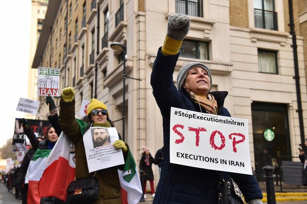 December 17, 2022, London, England, United Kingdom: Protesters take part in a demonstration in central London, calling to stop executions of protesters in Iran, and in solidarity with the freedom uprising in Iran, over the death of Mahsa Amini in custody, by Iranian morality police. Mahsa Amini was killed on 16 September, after her arrest for allegedly breaching Iran s laws for women on wearing hijab, headscarves and modest clothing. London United Kingdom - ZUMAk172 20221217_zip_k172_013 Copyright: xThomasxKrychx