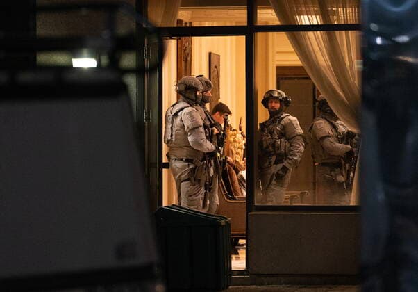 December 18, 2022, Vaughan, ON, CANADA: York Regional Police tactical officers are seen in the lobby of a condo building in Vaughan, Ont., Sunday, Dec. 18, 2022. Police say multiple people are dead, including the suspect, after a shooting in an apartment building. Vaughan CANADA - ZUMAc35_ 20221218_zaf_c35_134 Copyright: xArlynxMcadoreyx