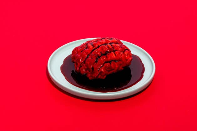 Edible fake brain with fake blood placed on white round plate on red background SergioVictorVega_ID8072_242958_015 Copyright: xSergioxVictorxVegax Model Released