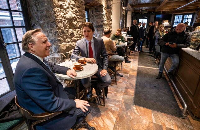 December 20, 2022, Montreal, PQ, Canada: Prime Minister Justin Trudeau and Quebec Premier Francois Legault chat over coffee in a coffee shop in Montreal, on Tuesday, December 20, 2022. Montreal Canada  - ZUMAc35_ 20221220_zaf_c35_009 Copyright: xPaulxChiassonx