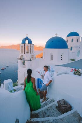 Creative Highlights Symbolbilder RECORD DATE NOT STATED Santorini Island Greece, couple men and woman on vacation at the Greek Island of Santorini visit the white village of Oia Santorini. Greece, model released, , 34964210.jpg, travel, europe, tourism, architecture, vacation, aegean, holiday, traditional, village, church, house, white, summer, blue, greece, sea, landscape, building, view, santorini, romantic, cyclades, island, oia, greek, town, caldera, mediterranean, volcano, destination, mountain, honeymoon, tourist, thira, ocean, holidays, touristic, famous, culture, luxury, sunset, dome, steps, vacations, city, roof, domes, architectural, christian, classical