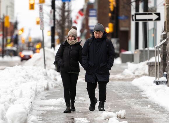 December 23, 2022, Ottawa, ON, CAN: Pedestrians make their way along Ottawa s Elgin Street amid high winds, as a winter storm warning is in effect, on Friday, Dec. 23, 2022. Ottawa CAN  - ZUMAc35_ 20221223_zaf_c35_010 Copyright: xJustinxTangx