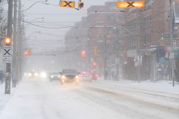 December 23, 2022, Toronto, ON, CANADA: Cars drive through blowing snow during a snowstorm in Toronto on Friday, December, 23, 2022. A winter storm warning is in place for most of southern Ontario. Toronto CANADA  - ZUMAc35_ 20221223_zaf_c35_050 Copyright: xArlynxMcadoreyx