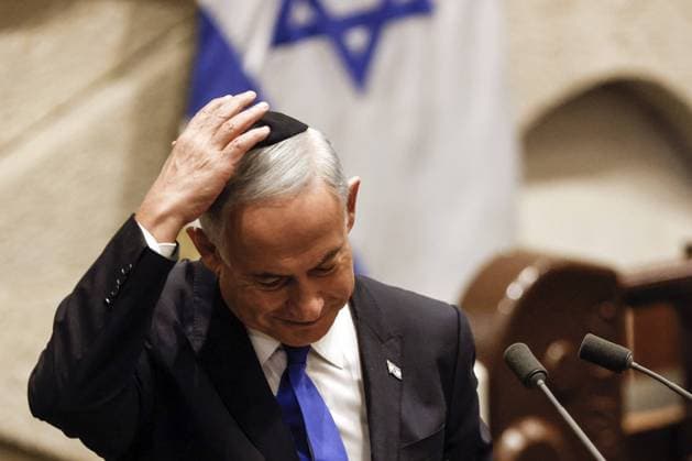 Benjamin Netanyahu adjusts his skull cap after speaking during a special session of the Knesset to approve and swear in a new right-wing government in Jerusalem on Thursday, December 29, 2022. Netanyahu became the Prime Minister of Israel for the third time. Pool  JERX2022122906 AMIRxCOHEN