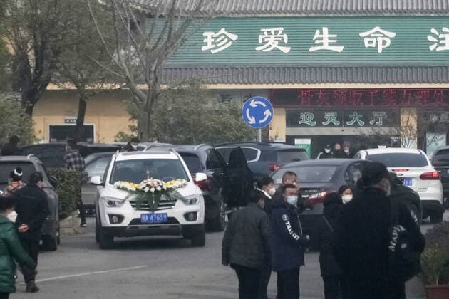 Wuhan amid COVID surge A funeral hall in Wuhan is crowded with cars and people on Dec. 29, 2022, amid a surge in COVID-19 cases. The Chinese government eased its strict antivirus measures earlier in the month.  A14AA0001380146P