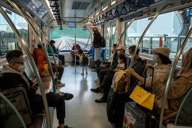 Daily Life In Macau Commuters wearing face masks riding on the Macao Light Rapid Transit on December 29, 2022 in Macau, China. Macau Macau  Copyright: xVernonxYuenx originalFilename: yuen-dailylif221229_npKcJ.jpg