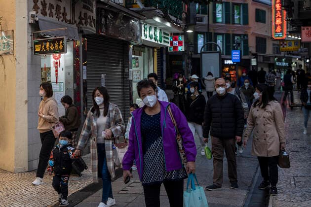 Daily Life In Macau People wearing face masks walk down a street on December 29, 2022 in Macau, China. Macau Macau  Copyright: xVernonxYuenx originalFilename: yuen-dailylif221229_nps9S.jpg