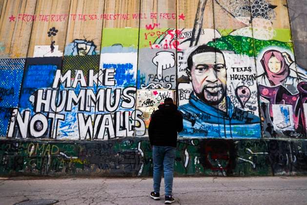 Street Art And Banksy Hotel In Bethlehem Make Hummus Not Walls street art graffiti and George Floyd s poitrait are seen on the Israeli separation West Bank Wall in Bethlehem, Palestine on December 28, 2022. Bethlehem Palestine  Copyright: xBeataxZawrzelx originalFilename: zawrzel-streetar221228_np2mg.jpg
