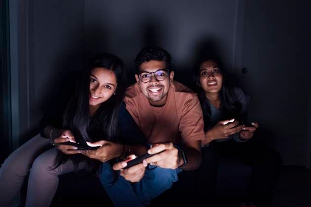 Happy man and women playing game in room at home model released, Symbolfoto property released, MEUF08693