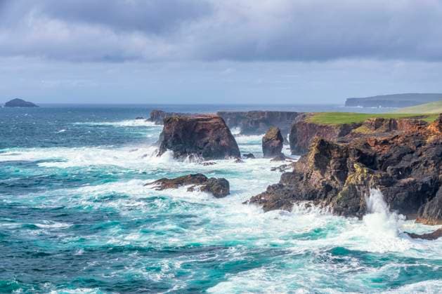 UK, Scotland, Waves splashing against cliffs of Esha Ness, SMAF02394