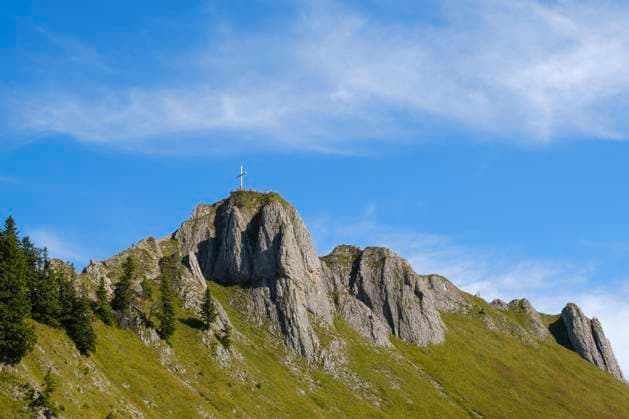 Summit cross on top of Tegelberg mountain under blue sky, WIF04657