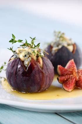 Figs stuffed with blue cheese Figs stuffed with blue cheese and thyme, seasoned with honey Copyright: xZoonar.com MarynaxVoronovax 16417374