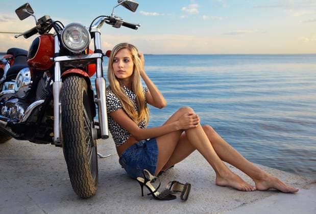 blonde and red motorcycle young beautiful blonde outdoors, posing with red motorcycle on quay Copyright: xZoonar.com SergxZastavkinx 2150276 ,model released, Symbolfoto ,property released