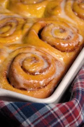 bun of pumpkin with cinnamon bun of pumpkin with cinnamon in the form of snails in a creamy glaze ceramic roasting pan Copyright: xZoonar.com MarynaxVoronovax 9826114