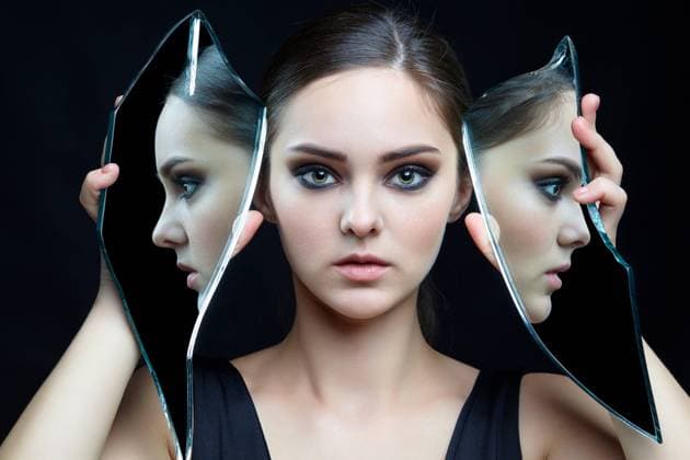 Young female with eyes closed and mirror shard in hands. Girl with a shard of the mirror. Female with mirror shard in hand posing on gray background. Face reflection in mirror splinter. Copyright: xZoonar.com SergeyxPistyazhnyukx(SergxZastavkin)x 16987148 ,model released, Symbolfoto ,property released