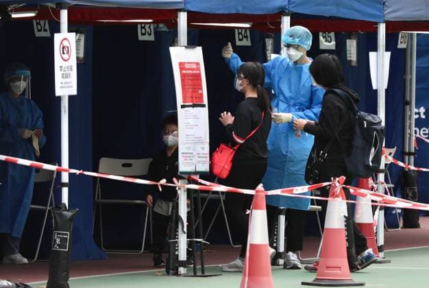 January 7, 2023, HONG KONG, CHINA: In Hong Kong, medical staff gestures as citizens are about to receive Covid-19 testing at the city centre. It is required for Hong Kong citizens and foreigners to obtain Nucleic Acid Testing NEGATIVE certificate 48 hours prior to departure for China Mainland via land port.Jan-7,2022Hong Kong.ZUMA HONG KONG CHINA - ZUMAl137 20230107_zap_l137_002 Copyright: xLiauxChung-renx