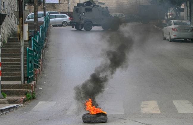 News Themen der Woche KW02 January 12, 2023, Nablus, West Bank, Palestine: Israeli military vehicles are stationed during a raid on the city of Nablus, north of the occupied West Bank. Israeli forces stormed the old city of Nablus and arrested five Palestinians, Asaad Al-Samhan, Ihab Ansar, Tamer Nassar, Jihad Mihrab and Iyad Shabaro. Nablus Palestine - ZUMAs197 20230112_zaa_s197_089 Copyright: xNasserxIshtayehx