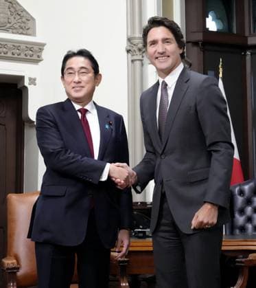 Japan-Canada summit in Ottawa Japanese Prime Minister Fumio Kishida (L) and Canadian Prime Minister Justin Trudeau shake hands during their talks in Ottawa on Jan. 12, 2023.  A14AA0001383877P