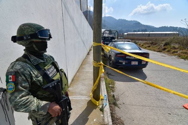 More than 20 bags with human remains found in clandestine grave in the State of Mexico January 13 in Tenango del Valle, Mexico : Forensic experts of the State of Mexico carry out the diligences where were found in a clandestine grave inside an industrial warehouse at least 26 packages with human remains; Military in company of the police of the State of Mexico guard the perimeter. on January 13 in Tenango del Valle, MÃ xico. (Photo by Arturo Hernandez Eyepix Group) Copyright: xArturoxHernandezx xEyepixxGroupx AH_130123_05